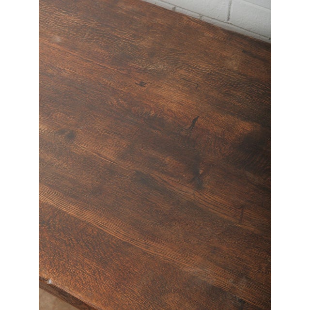 This impressive antique solid oak dining table showcases remarkable craftsmanship and enduring character, perfect for both...