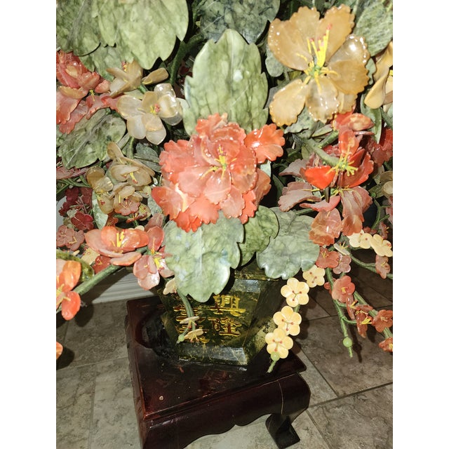 This is an exceptionally rare and important work of Chinese decorative art, categorized as a monumental hardstone floral...