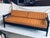 Beautiful 1970 MCM sofa with sold wood frame, multi shades of orange, yellow and brown strips on the cushion and 2 back...