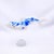 This artwork features a stylized fish, elegantly rendered in a glossy resin cast and adorned with intricate blue patterns...