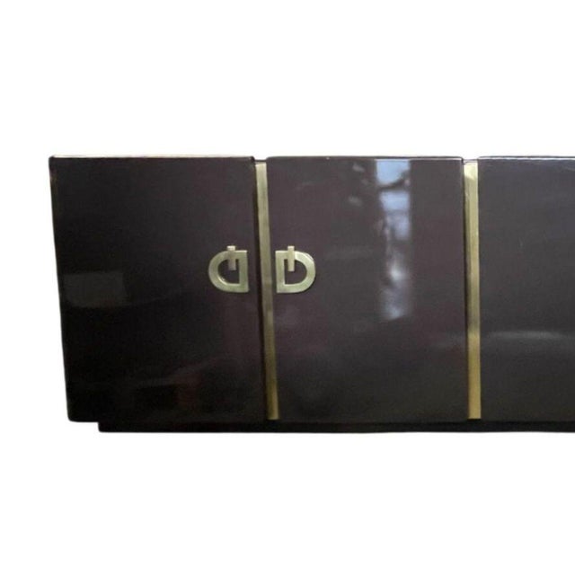 A striking large lacquered credenza/sideboard by Pierre Cardin, dating to circa 1960's. This sculptural piece features a...