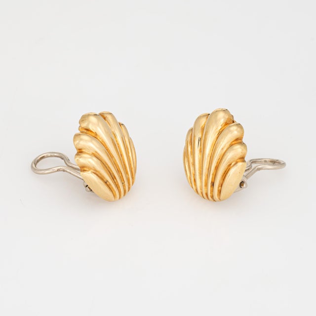 Finely detailed pair of vintage Tiffany & Co shell earrings crafted in 18k yellow gold (circa 1970s to 1980s). The stylish...