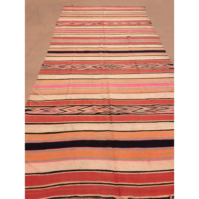 Authentic vintage Moroccan Berber flat-weave kilim rug, handwoven in wool and distinguished by its exceptionally long,...