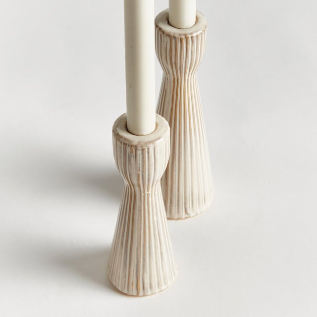 Made of a highfired, durable stoneware, and finished with a dynamic reactive glaze, these candle stands are a beautiful...