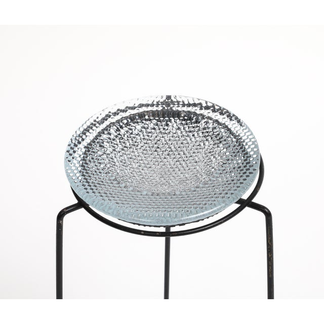 Vintage midcentury 1950s French perforated metal side table with three legs. The glass and perforated metal support at the...