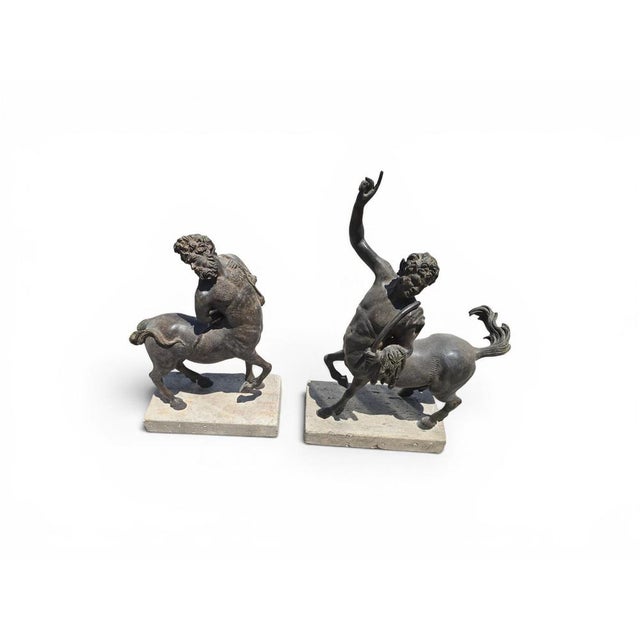 Elegant pair of bronze sculptures depicting centaurs, created during the first half of the 20th century and inspired by...