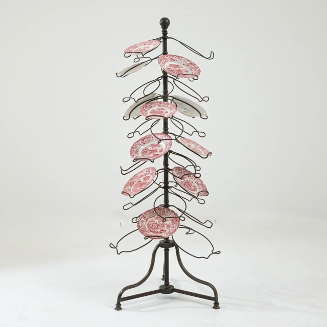 A vintage metal plate holder, an ‘etagere’ in the brasserie style. With a dazzling configuration of twisted wire plate...