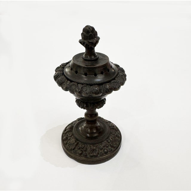 Neoclassical urn-shaped perfumer from the Regency period (1812-1820). It is beautifully patinated bronze and decorated...
