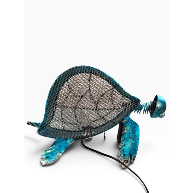 A wonderfully whimsical vintage sculptural turtle lamp with a striking turquoise painted-metal finish and intricate wire-...
