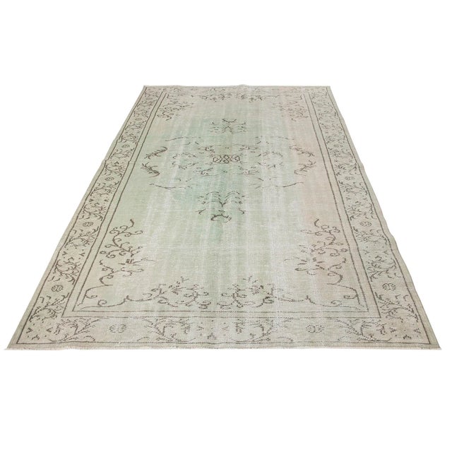 Decorative overdyed handknotted vintage rug from Oushak region of Turkey. Approximately 50-60 years old. In very good...