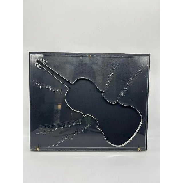 Relief painting with acrylic glass plate with a carved violin, mounted on wood