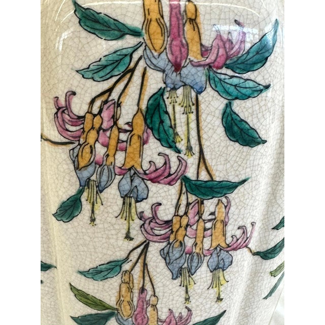 Detailed mid 20th century chinoiserie trumpet flower lamp with crackle glaze finish and gold finished base. This lamp...