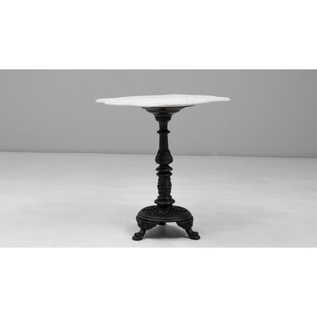 This 20th Century French cast iron bistro table with marble top brings together classic café style and durable, time-...