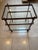 Elegant vintage three-tier bar cart or serving trolley featuring a richly textured faux tortoise finish with inset glass...
