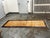 Design Plus Gallery presents a Vintage 3ft 5in × 9ft 5in Hand-Knotted Wool Tribal Runner Rug. A gold-tone field displays...