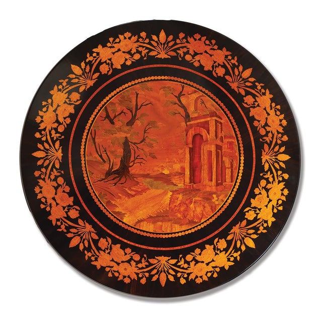 Handcrafted in Italy, this Empire Style accent table features a richly detailed marquetry top showcasing decorative inlaid...