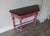 Bring warmth, character, and style into your home with this beautifully refinished antique console table. Showcasing an...