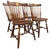 Set of four vintage Windsor dining chairs by S. Bent Bros.. Solid maple construction with sculpted saddle seats, turned...