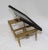 A dainty painted wood breakfast tray with folding legs.