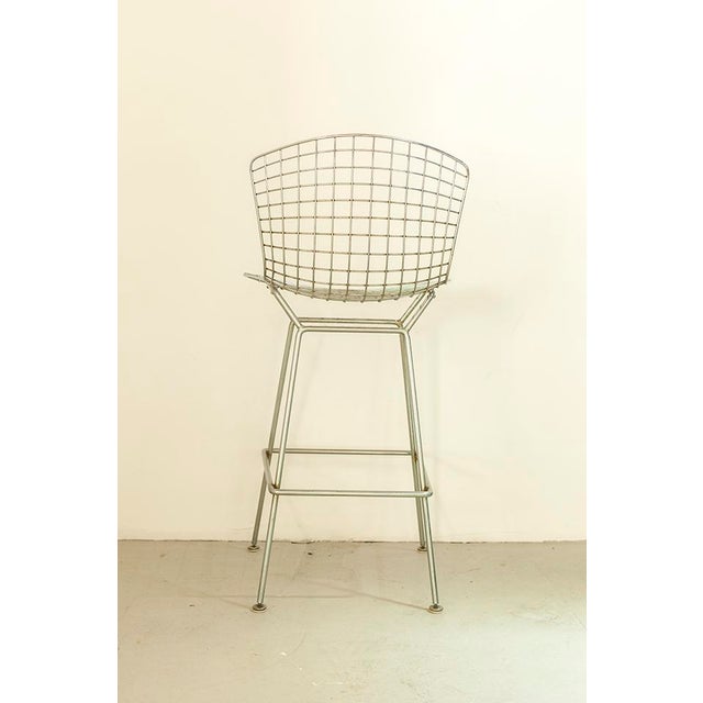 Bar Stool by Harry Bertoia for Knoll featuring a metal frame with a removable orange seat cushion. I have official proof...