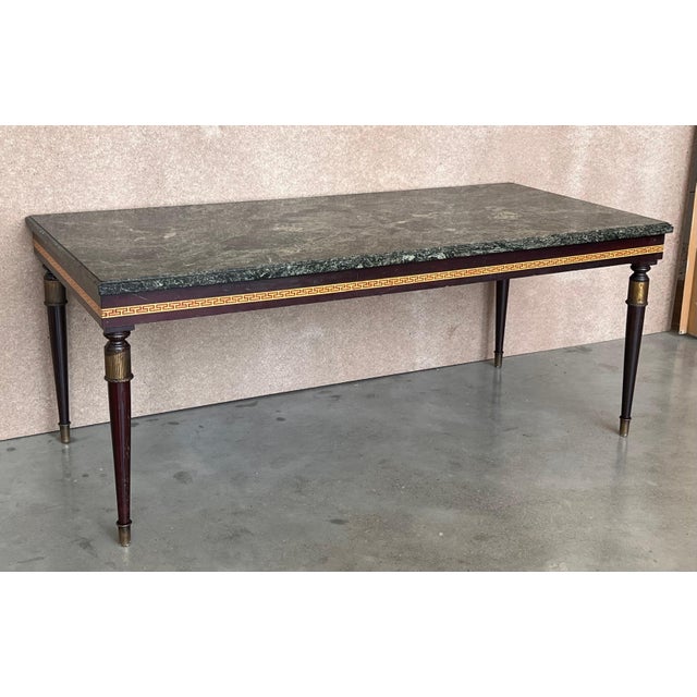 A extraordinary Italian mid-century coffee table attributed to renowned Maison Jansen. Exquisitely handcrafted, finished...