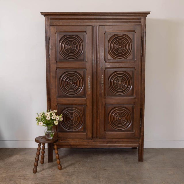 Incredible carved wood cabinet by Charles Dudouyt from France, 1940s. Beautiful carved wood circle and square detail on...