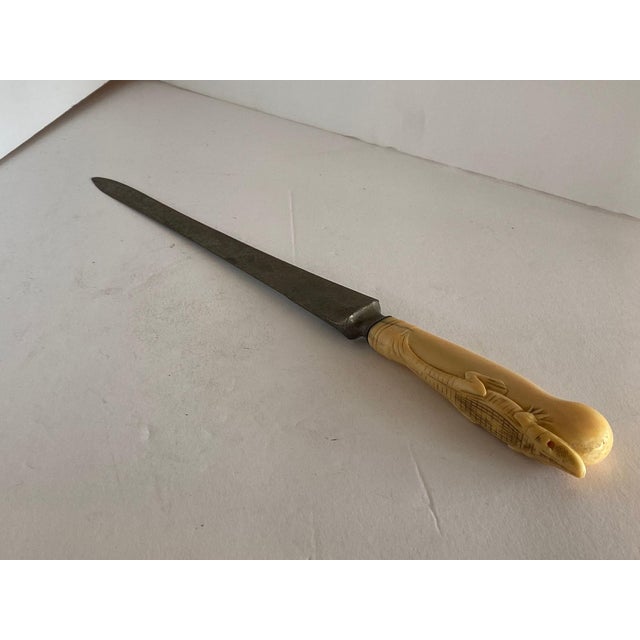 19th Century Hand-Carved Bone Alligator Handled Culinary Carving Set with a cutting knife, fork, and sharpener. This...