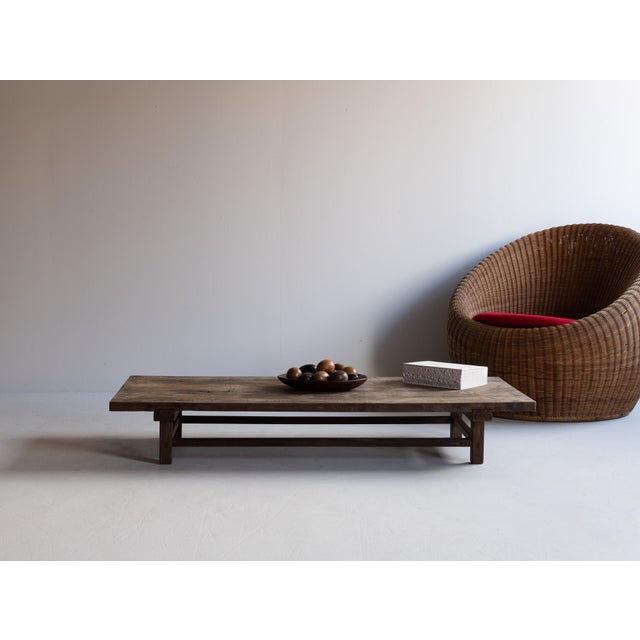 This piece is a Japanese wooden low table crafted during the Meiji to Taisho period (1868–1920). It is made from tochi...