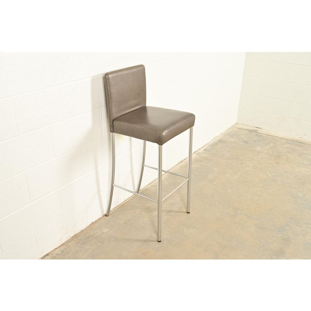 A gorgeous contemporary or Modern "Switch" bar stool By Coalesse for Steelcase USA, 2010 Leather upholstered seat and...