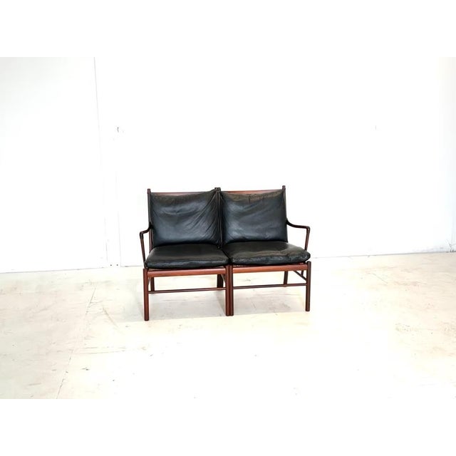 Manufacturer: Poul Jeppesens Møbelfabrik Designer: Ole Wanscher Model: OW 149 Upholstery: Nappa leather Color: Black...