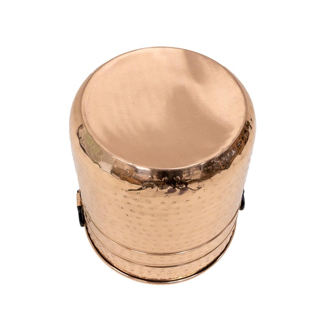 Copper container with wrought iron side handles, sized to hold firewood, but also suitable as a cachepot for a large...