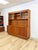 This impressive vintage MCM two piece teak china cabinet is a substantial and beautifully crafted dining room or living...