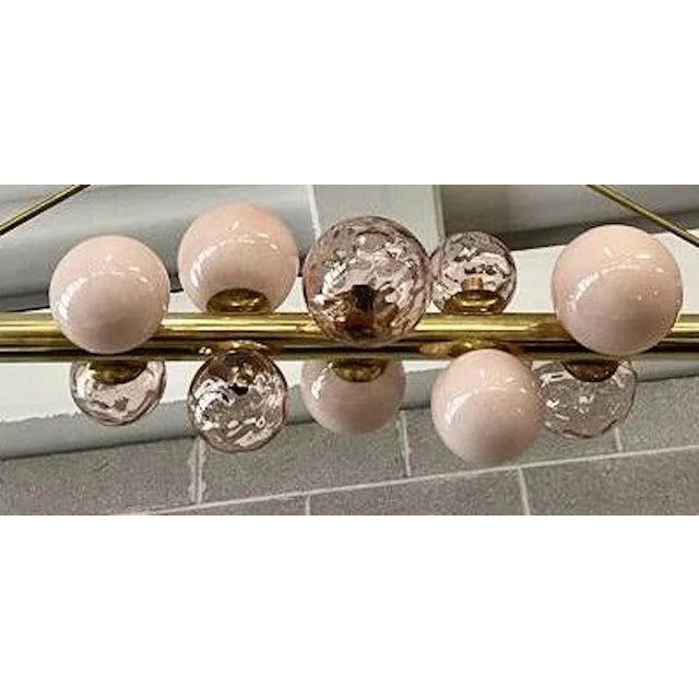 Characterized by simplicity and linearity Murano chandelier, its beautiful colors with more shades of pink color. The...