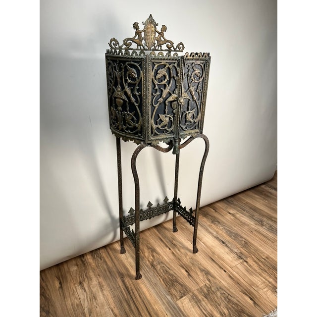 This is a truly striking example of a Gothic Revival telephone stand, attributed to the circle of Oscar Bach or Bertram...