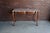 Charming Country French marble top console table. Crafted of walnut featuring cabriole legs grounded with pied de biche...