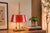 French-style bouillotte table lamp dating to the 1950s, with two candle-style fittings above a rectangular brass base. A...