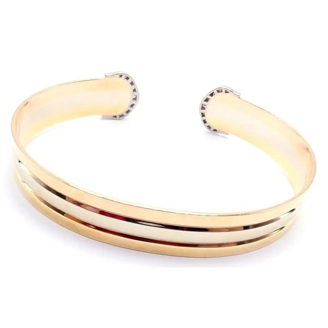 18k Tri-Color Gold (Yellow, White, Rose) Diamond Double-C Bangle Cuff Bracelet by Cartier. With 34 round brilliant cut...