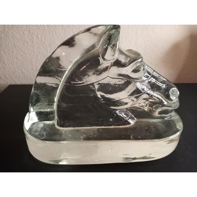 It is a Clear Glass Carved Horse Head. Can be Bookend or decor. Procured at an auction