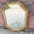 Found in its original vintage condition, this octagonal mirror is a quintessential example of 1970s Hollywood Regency...