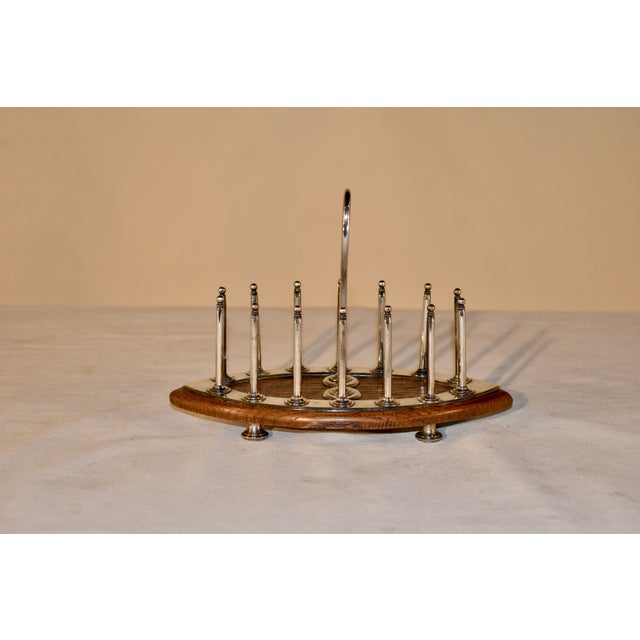 Unusual style Victorian oak and silver plated toast rack, attributed to John Grinsell & Son. The rack is supported on an...