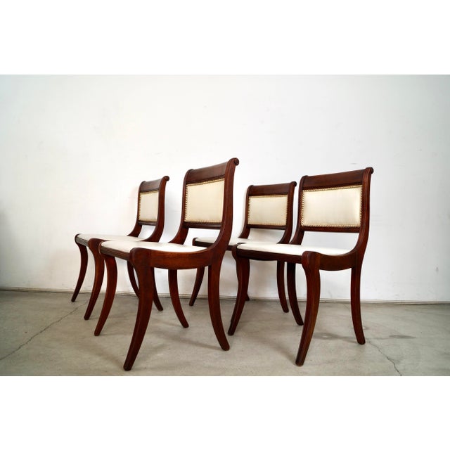Set of 4 antique dining chairs for sale. They're from the 1930's, and are really well made. They're made of solid mahogany...