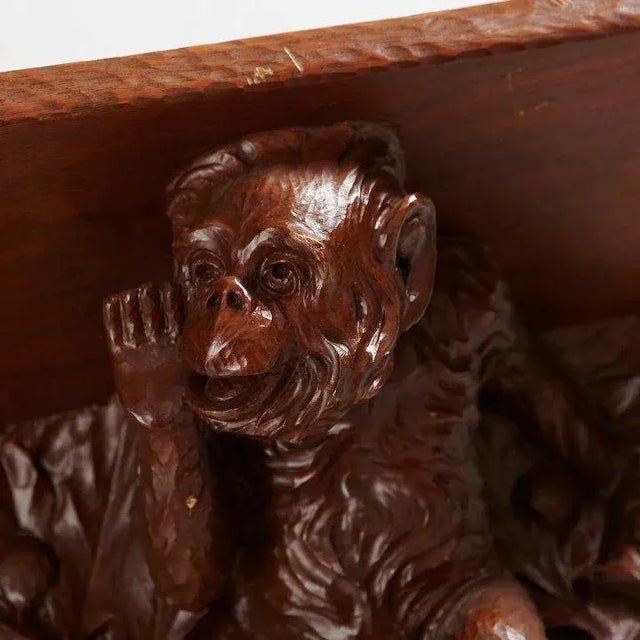 Found in Sweden, this antique German Black Forest bracket shelf finely carved with two charming monkeys as figural...