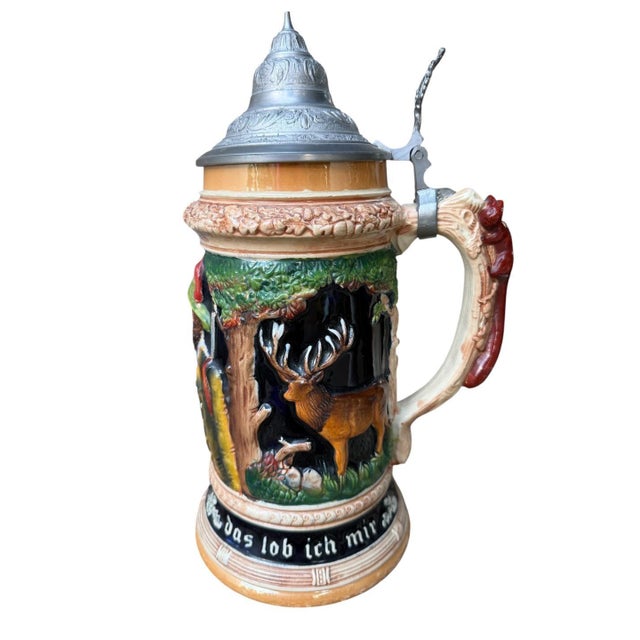 Large 2L German stein with stag, deer, and tree scenes, a hunting dog, and a squirrel-form handle — ornate pewter conical...
