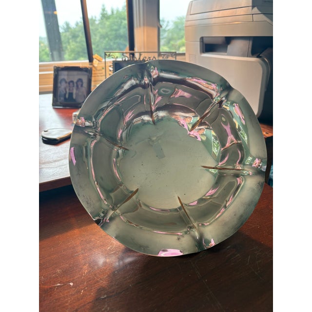 Delicate and elegant describes the lotus shaped silver bowl by Reed and Barton. The curves and waves to its design makes...
