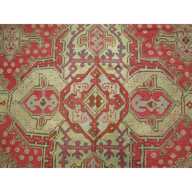 An early 20th century antique Turkish Oushak rug. 10'1'' x 13'7''