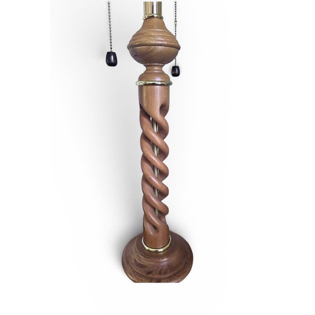 Fantastic Hollywood Regency table lamp by James Mont for Frederick Cooper. Features a natural wood carved open barley...