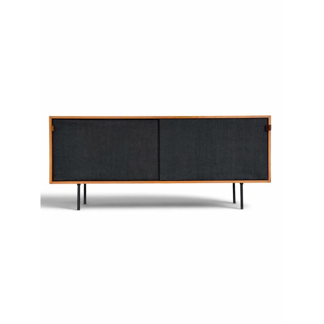 Early Florence Knoll Model 116 Maple Credenza with Black Grasscloth Sliding Doors, 1950s A beautifully preserved early...