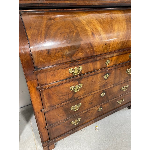 Unusual roll-top, - or "cylinder," - desk, circa 1790-1810. With dramatic flame grain mahogany matched fully across the...