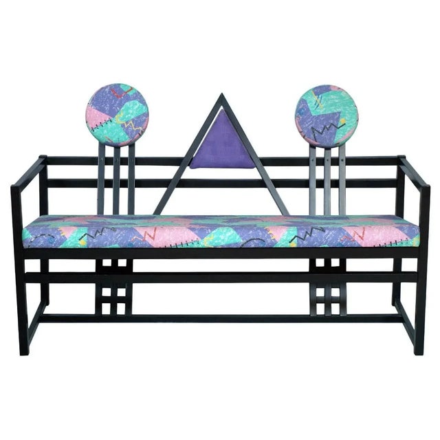 - Vintage sofa in black lacquered walnut - Features the original artistic upholstery - Reminiscent of works by...