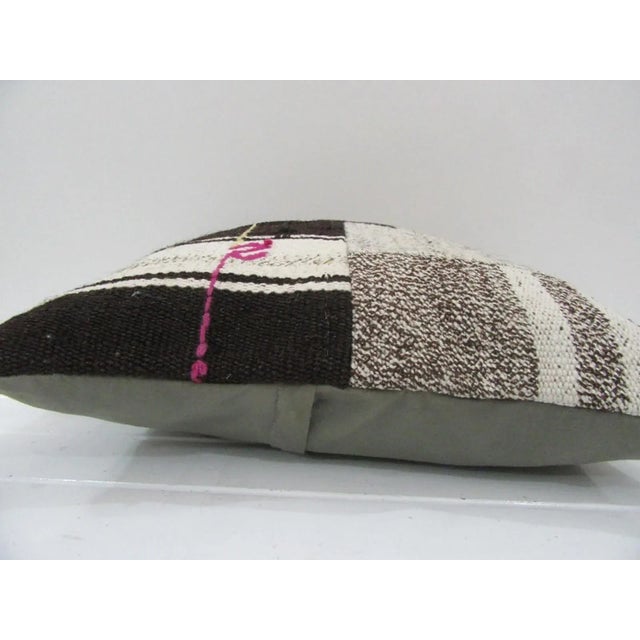 This is a pillow cover made from a vintage kilim rug. The piece was properly washed and ready to use. Pillow inserts not...